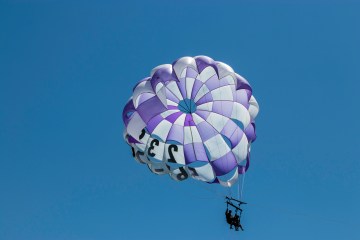 happy visitors in a parasail